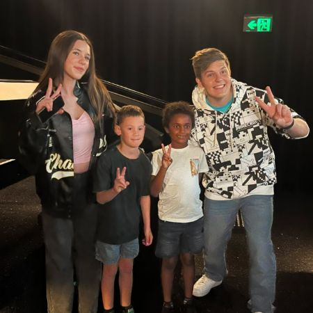 Prezley Lea with his sister, and fans in an event program.